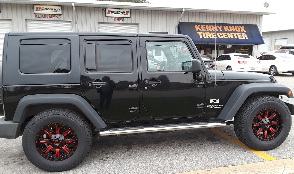 Red wheel installed on Jeep Wrangler