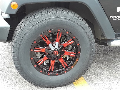 Red wheel installed on Jeep Wrangler